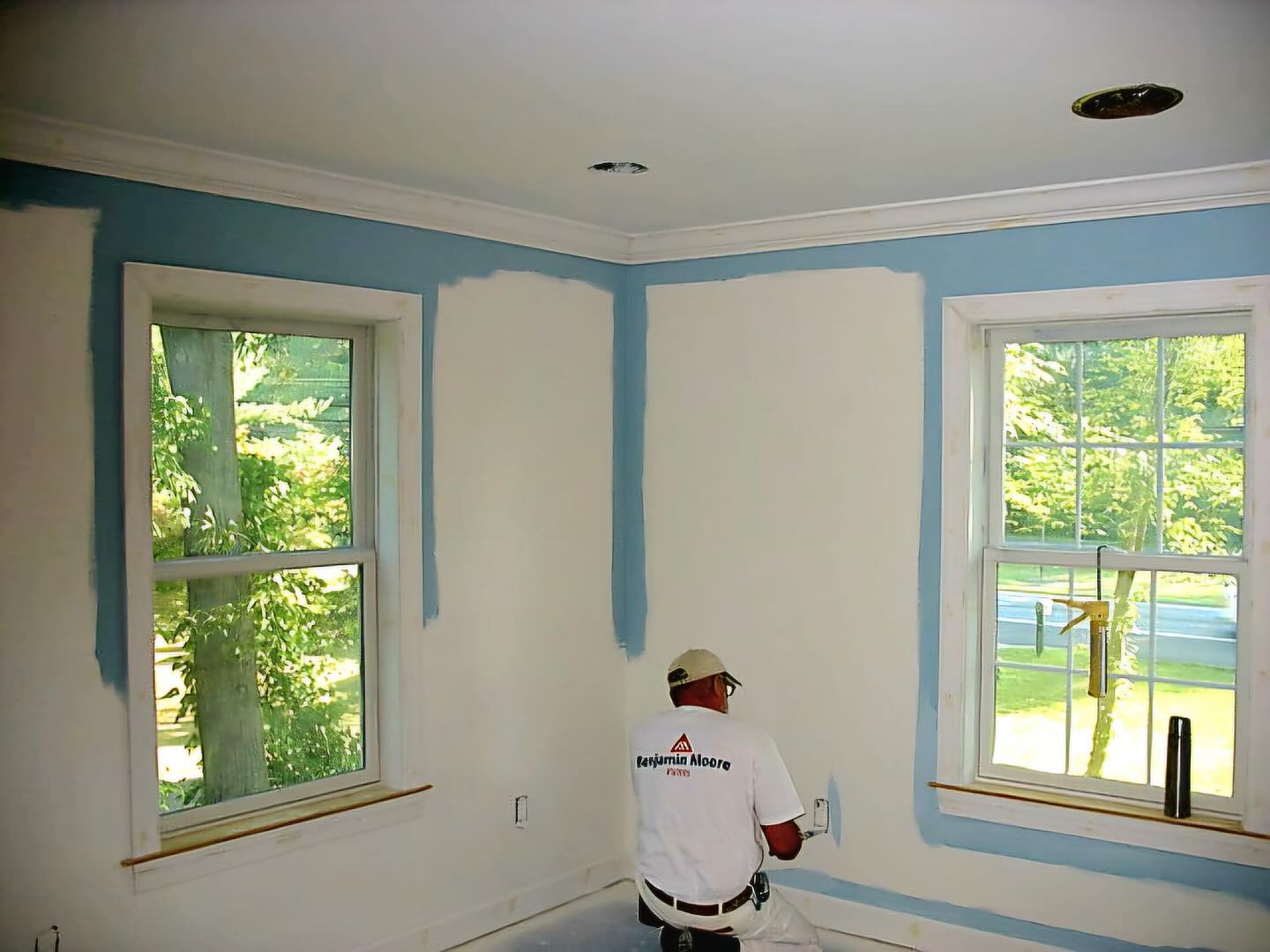 Affordable painter handling trim and wall touch-ups